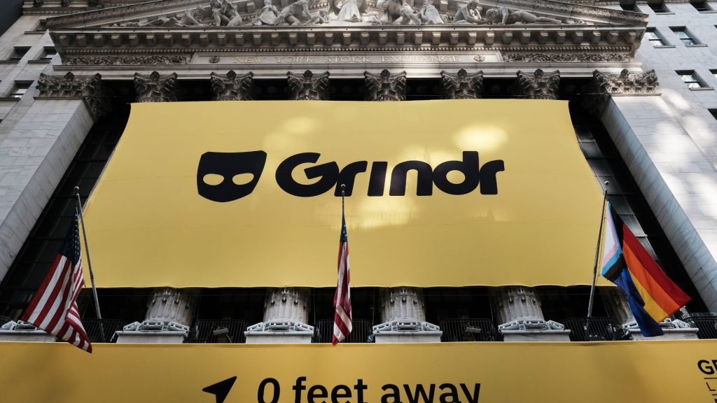 Grindr logo seen in a banner above the New York Stock Exchange