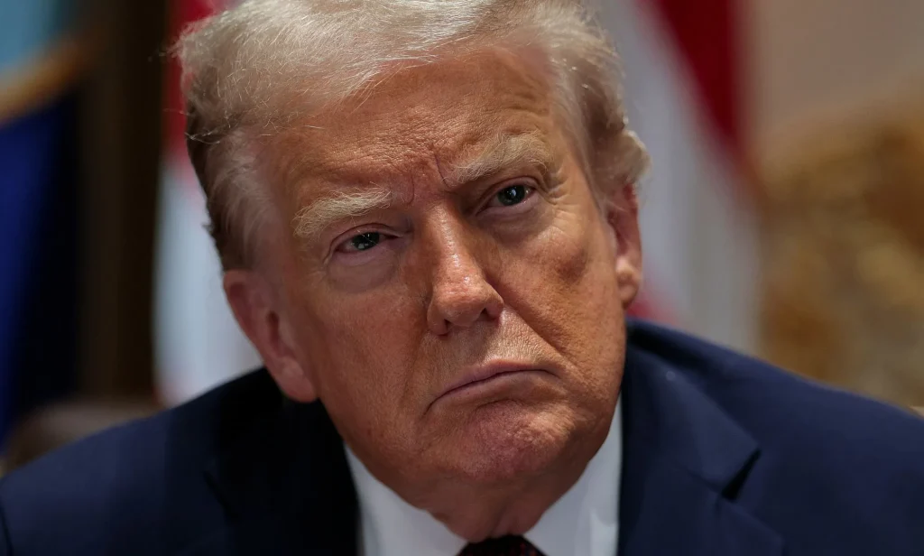 Donald Trump, pictured tilting his head.