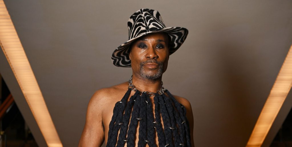 Billy Porter poses in a hat and fringe vest in May 2025.