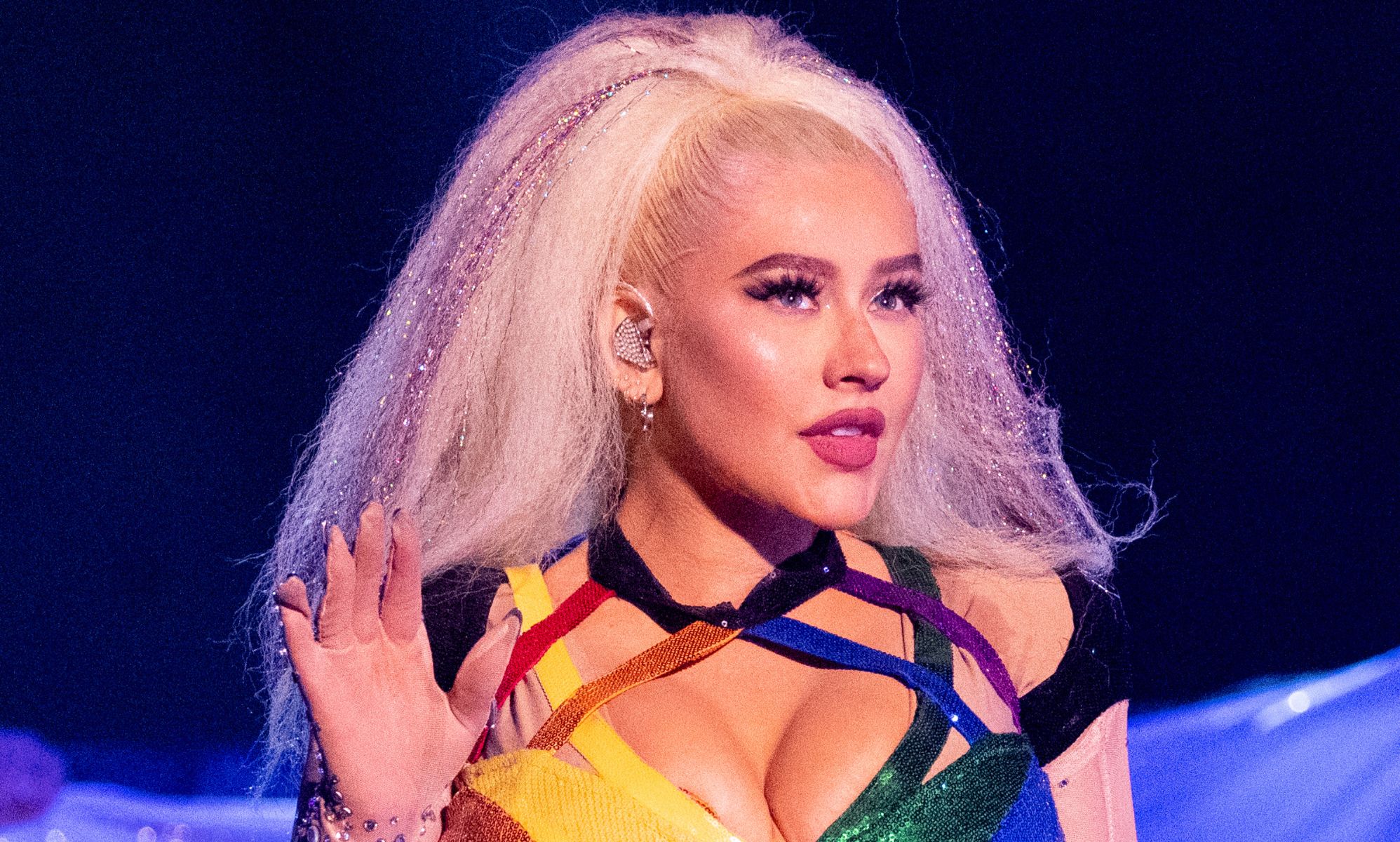 Christina Aguilera performing in a strappy rainbow top at LA pride.