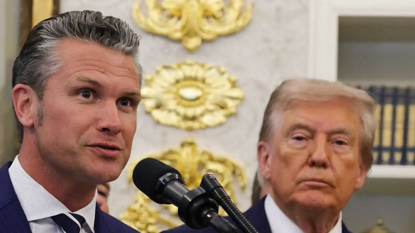 Defense Secretary Pete Hegseth speaks as U.S. President Donald Trump looks on in the Oval Office at the White House on September 2, 2025 in Washington, DC.