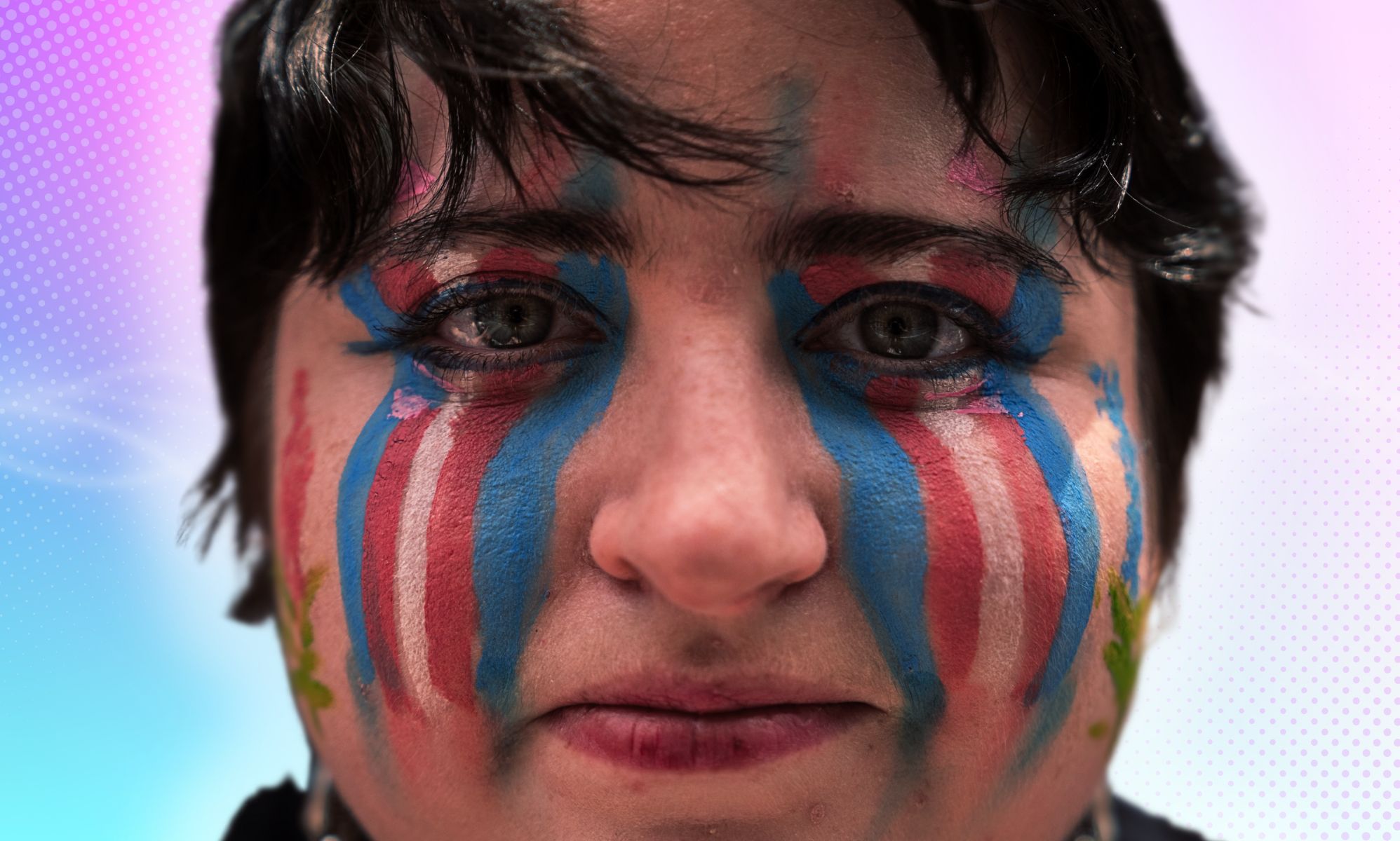 A person with trans make-up on their face.