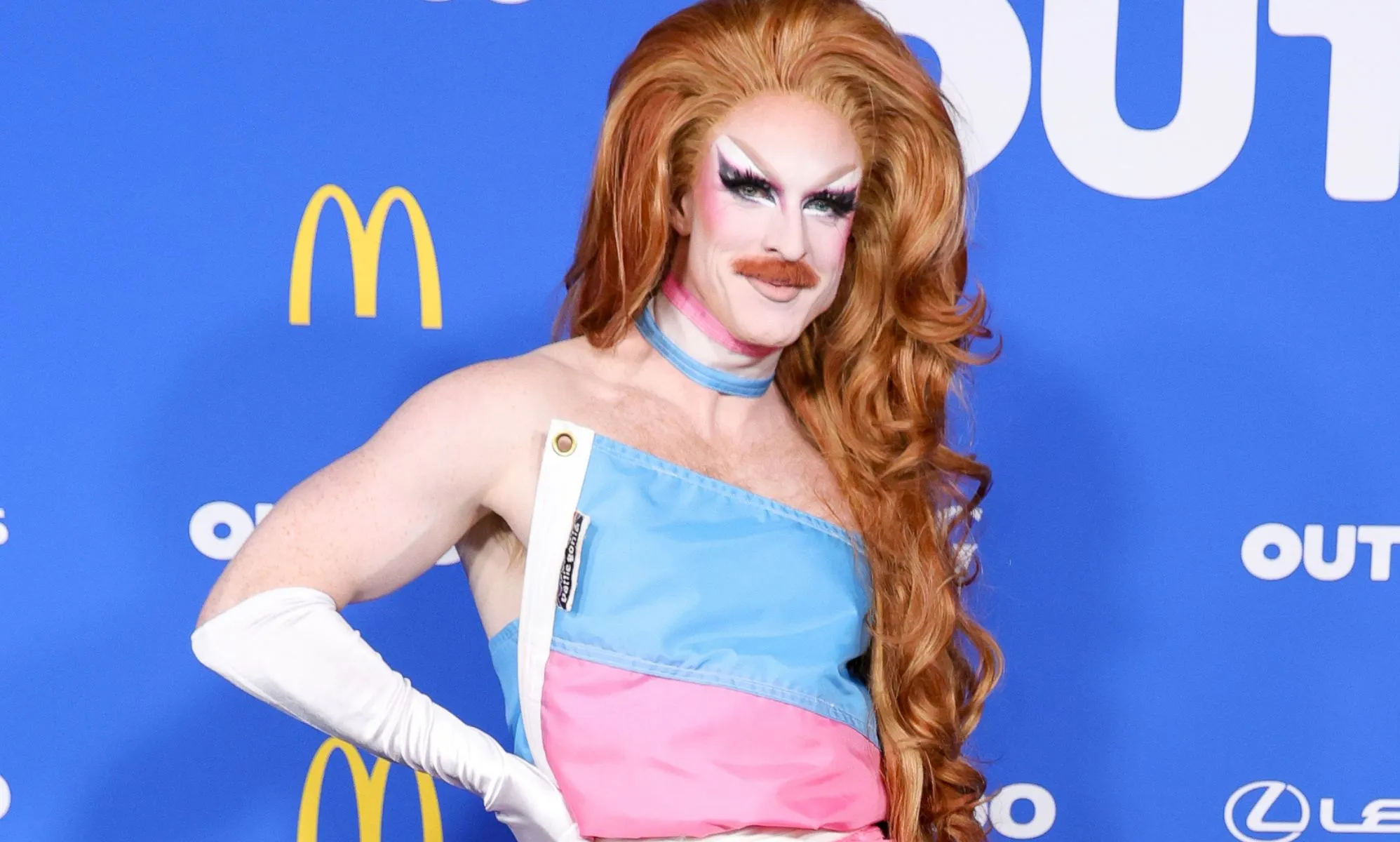 Pattie Gonia in her trans flag dress.