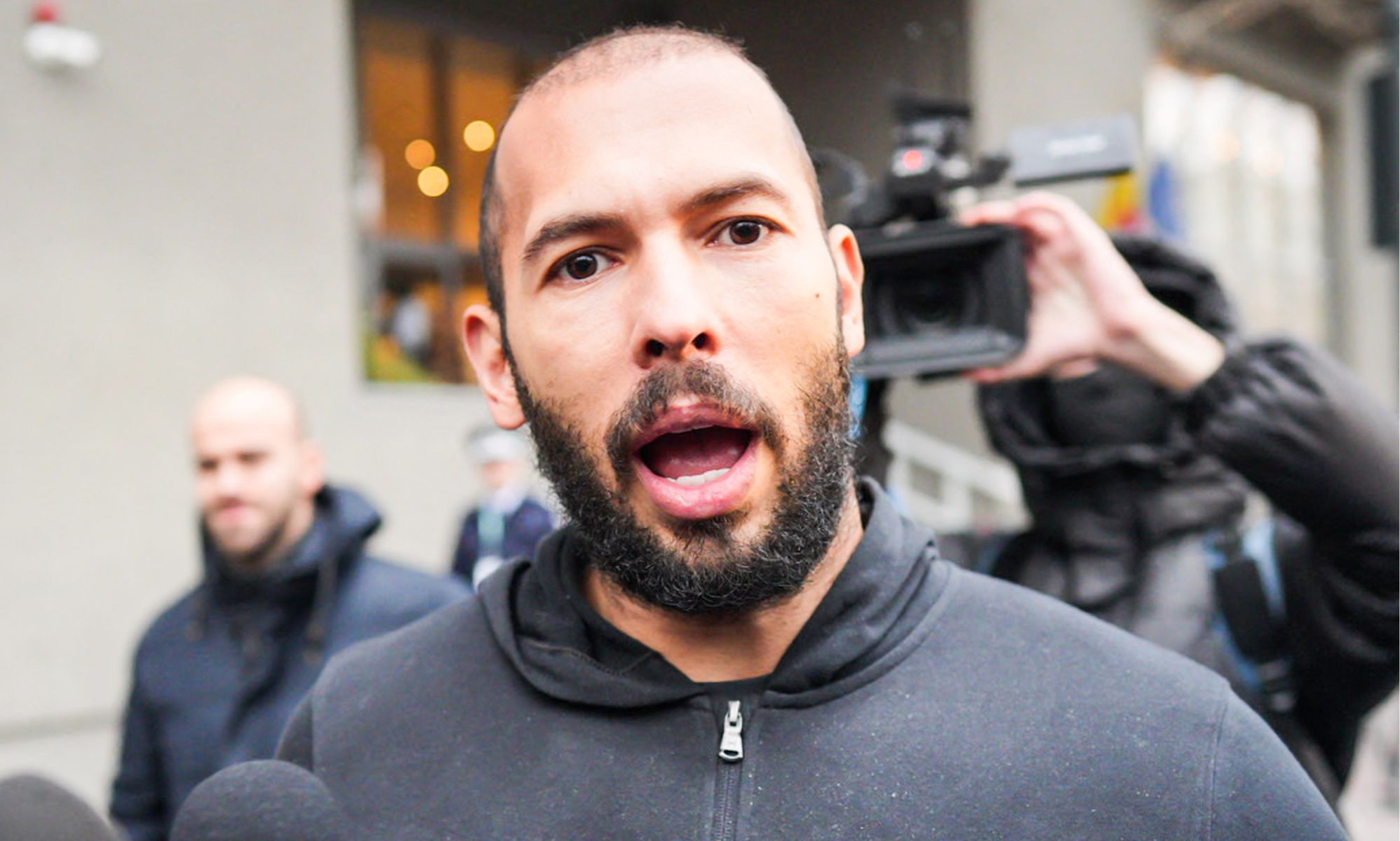 Andrew Tate speaking into a camera.