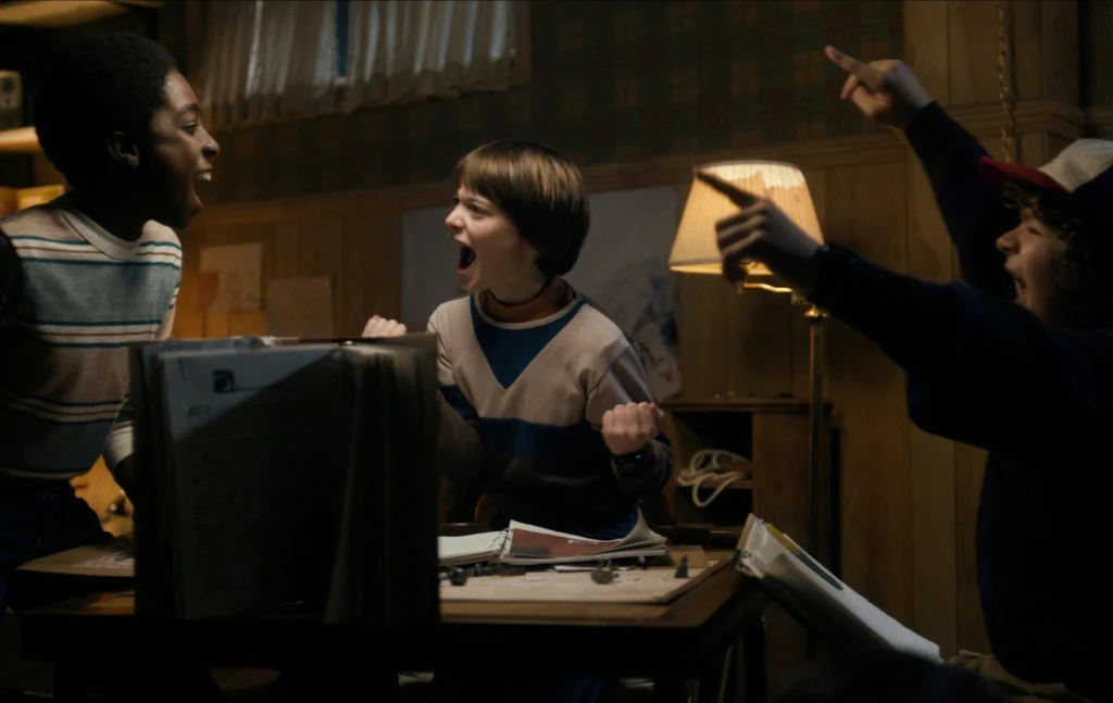 Stranger Things season 1 opening, three boys playing Dungeons & Dragons