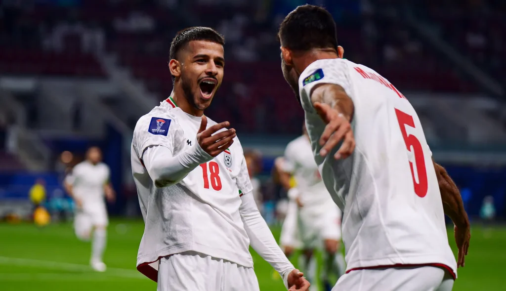 DOHA, QATAR - JANUARY 19: M. Ghayedi #18 of Iran celebrates scoring his team