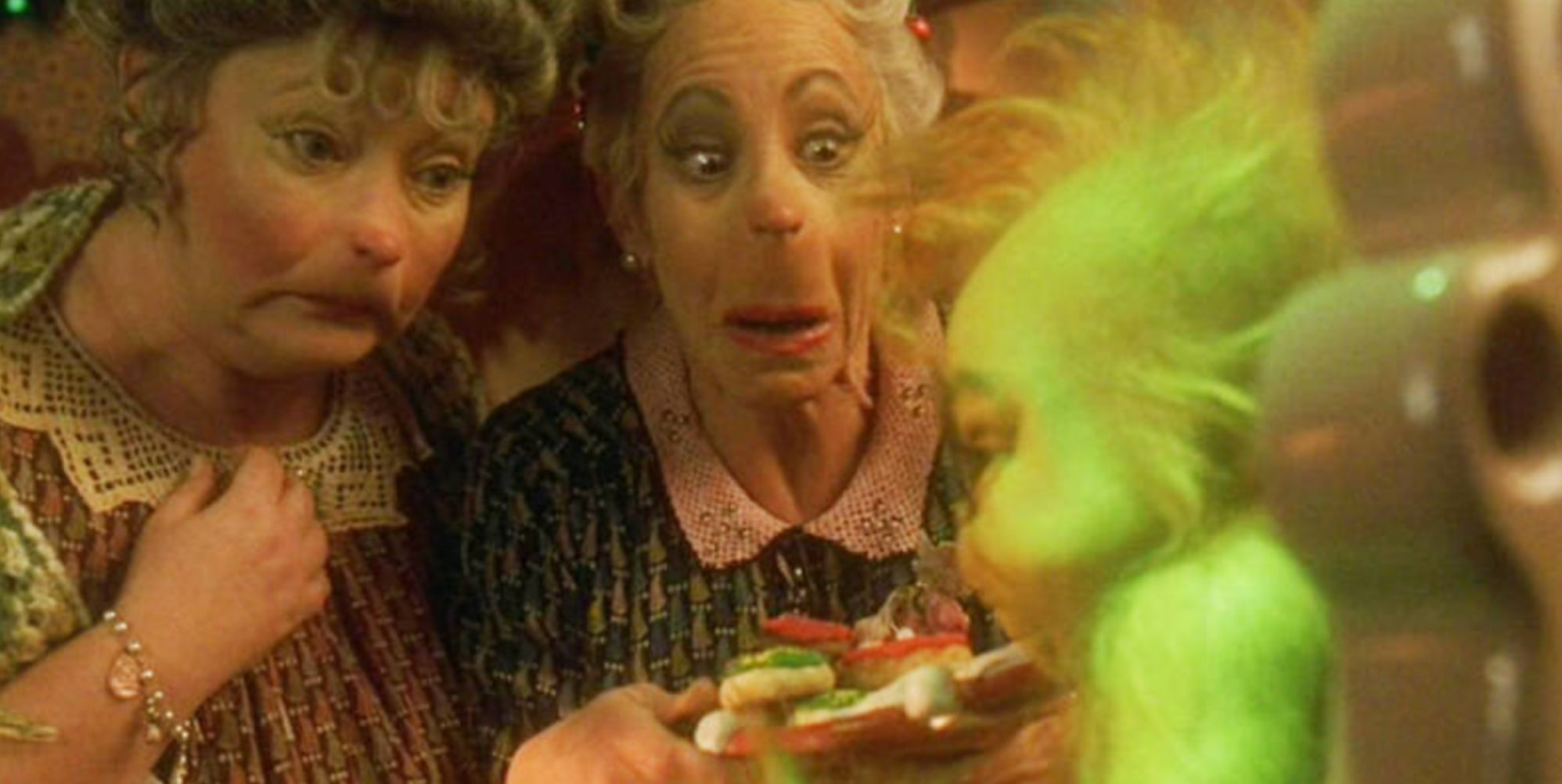 Clair Nella Who (Mindy Sterling) and Rose Who (Rachel Winfree) with the Grinch (Jim Carrey)