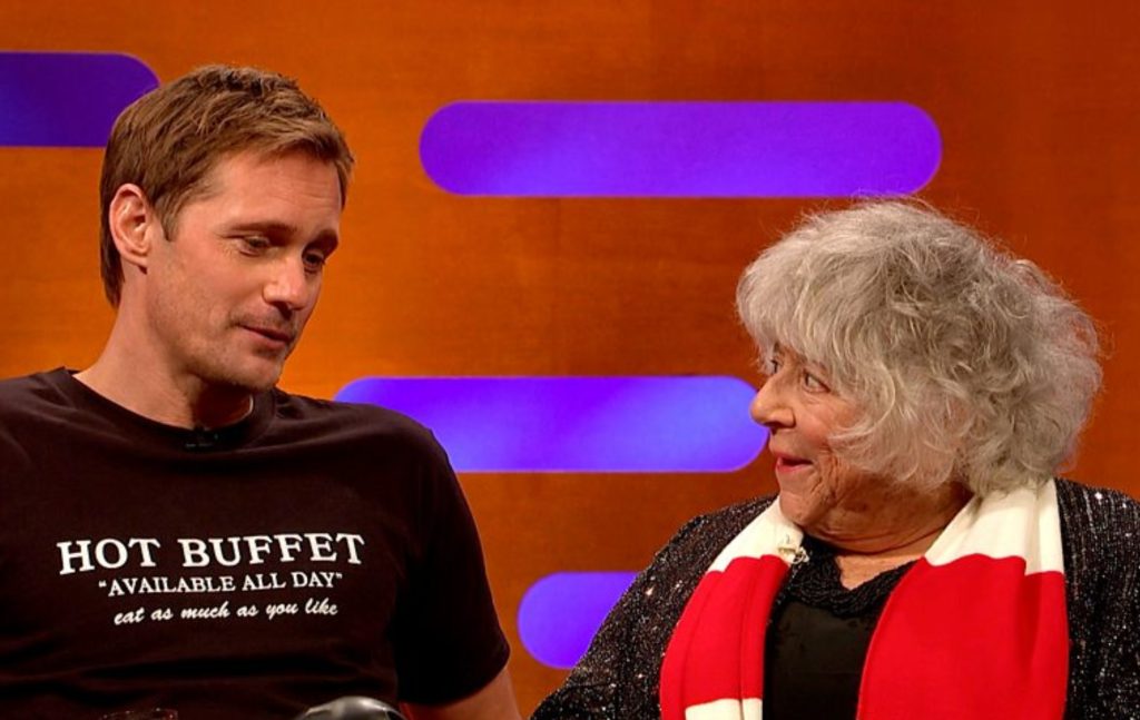 Alexander Skarsgård and Miriam Margolyes sitting beside eachother on The Graham Norton Show