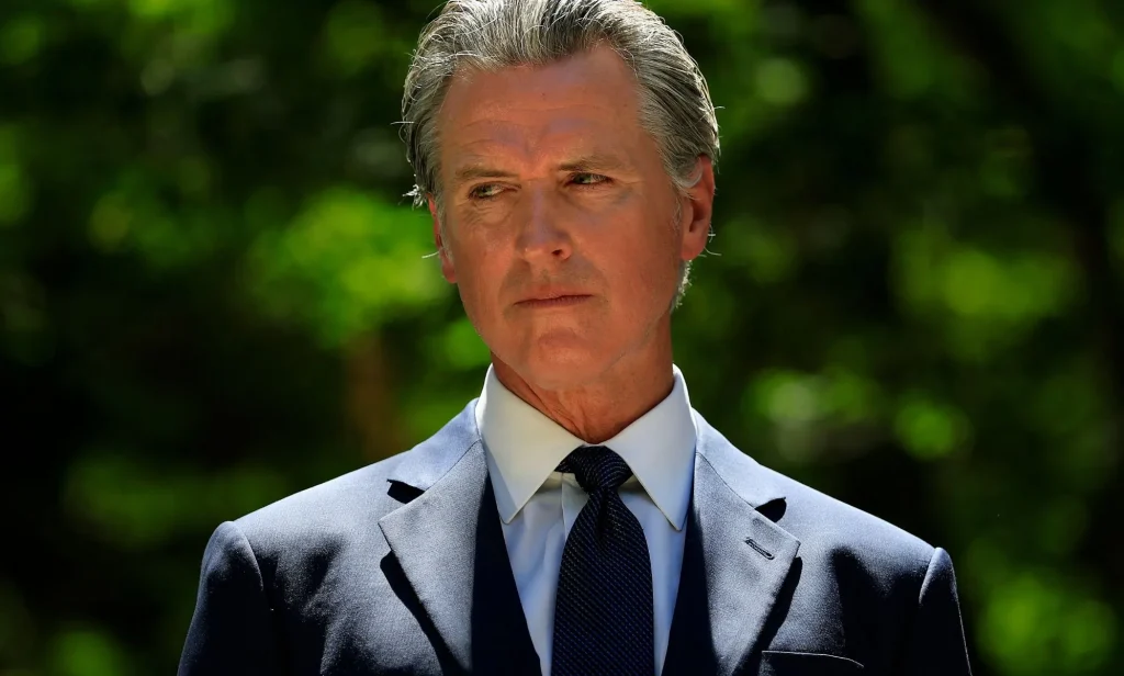 Gavin Newsom, pictured in a suit and tie.