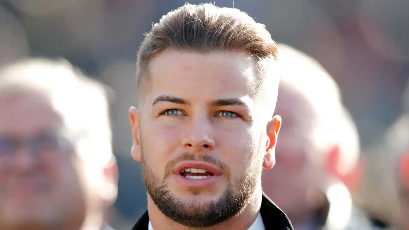 Chris Hughes watches the racing as he attends day 1