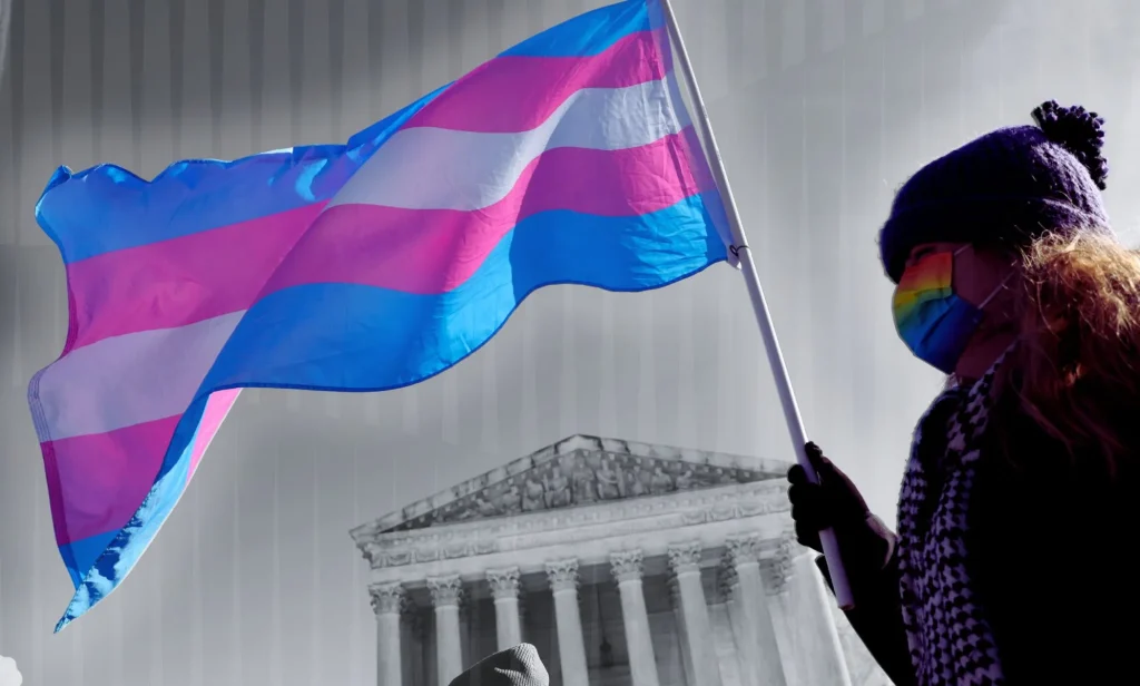 An edit of someone holding a trans flag outside the Supreme Court.