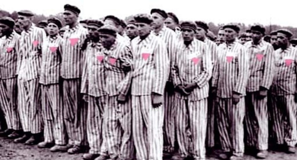Gay men wearing pink triangle, representing Holocaust Memorial Day