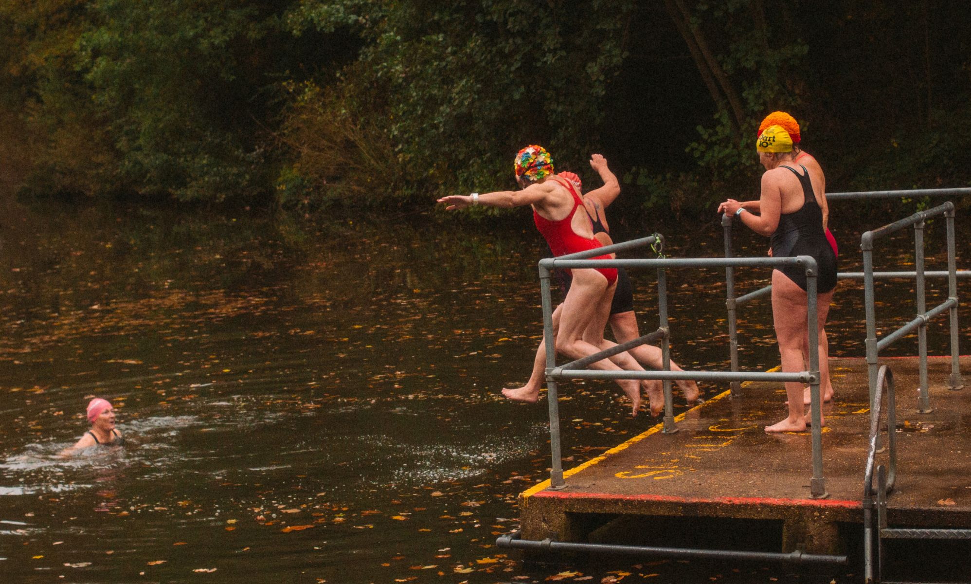 Women jumping into Kenwood Ladies