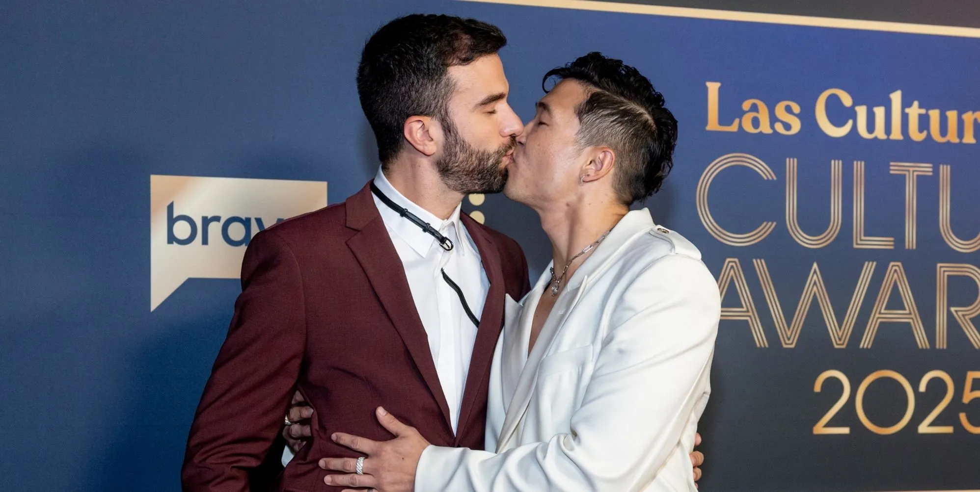 ohn-Michael Sudsina and Joel Kim Booster arrive at the Las Culturistas Culture Awards at The Orpheum Theatre on July 17, 2025 in Los Angeles, California.
