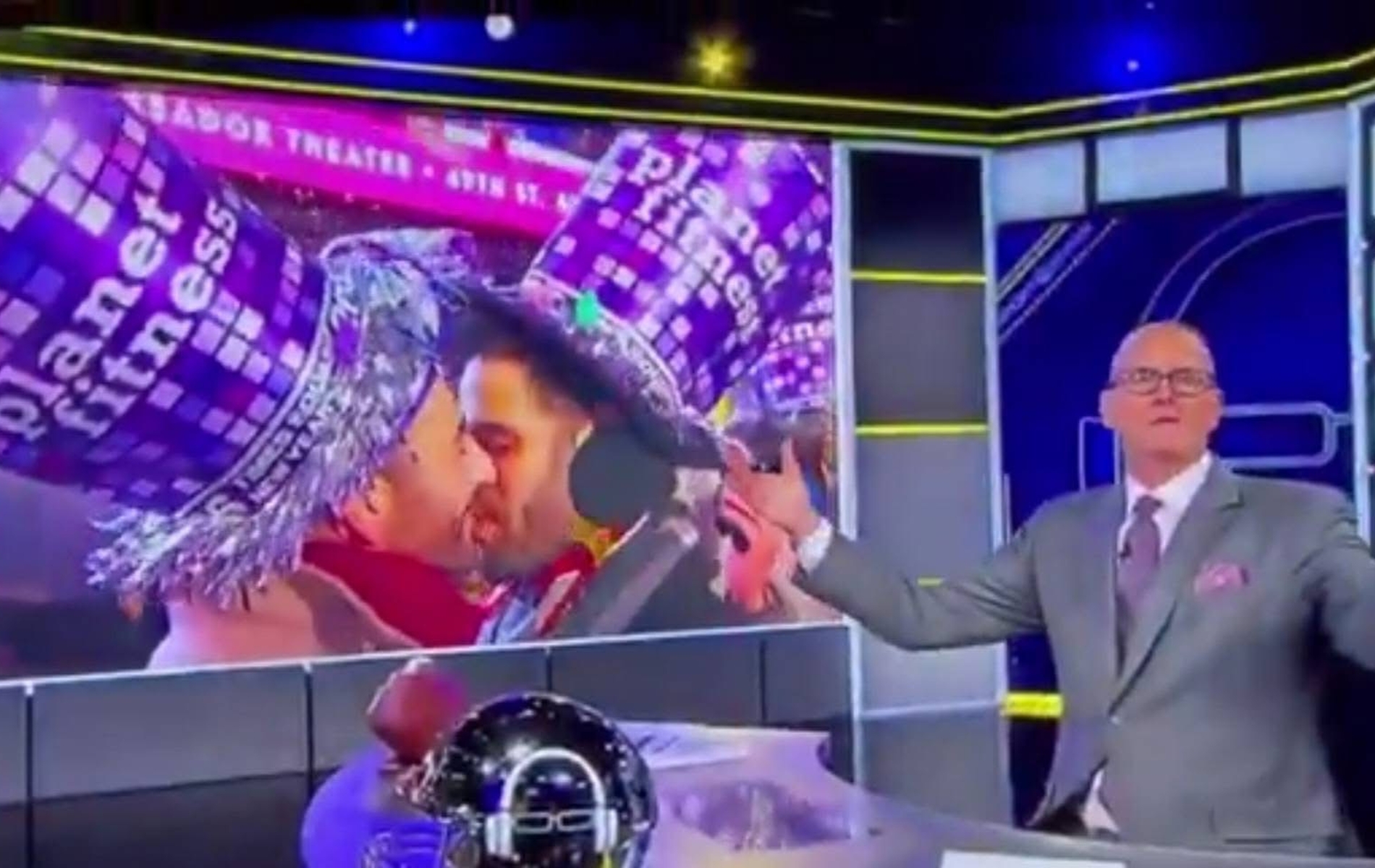 Scott Van Pelt goes viral for his reaction to a gay kiss. Image of the host in his studio with the gay New Year