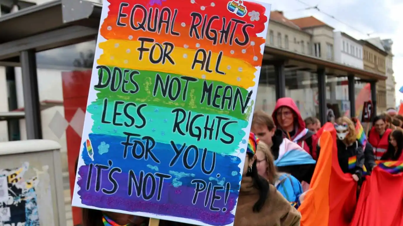 Participants wave a huge rainbow flag in the 17th Christopher Street Day (CSD) parade in Cottbus, Germany, under the motto United in Peace and Diversity