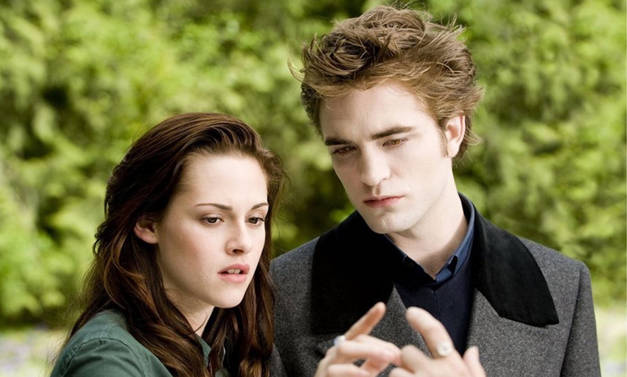 Bella and Edward in Twilight still, looking at their hands connecting