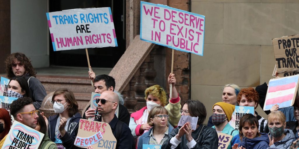 Trans rights demonstrators gather outside the Equalities and Human Rights Commission