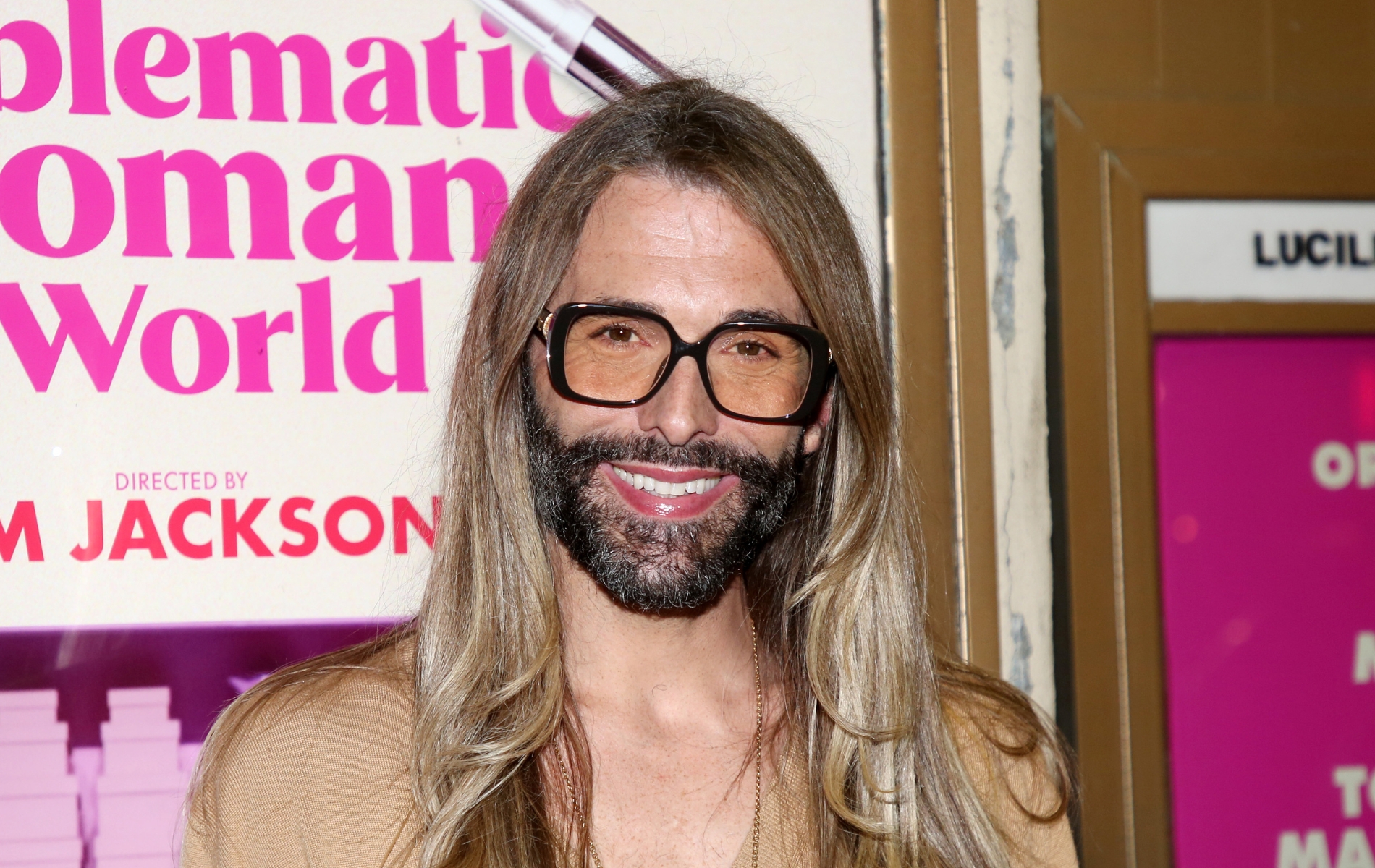 Jonathan Van Ness smiling in sunglasses
