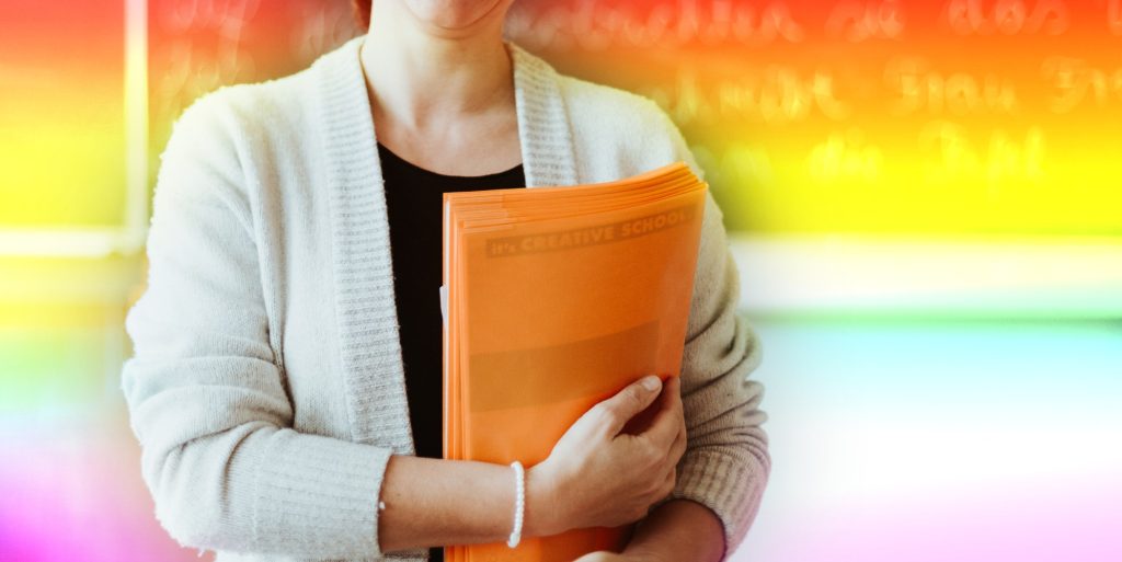teacher with gay pride flag colours