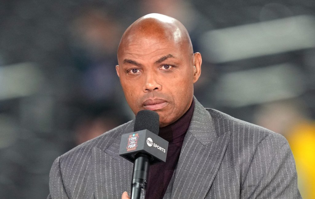 Charles Barkley appearing on NBA Tip-Off in a grey suit, holding the mic up to his mouth