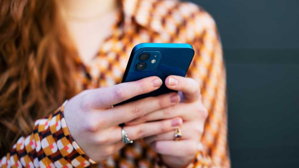 Close up of woman using smart phone
