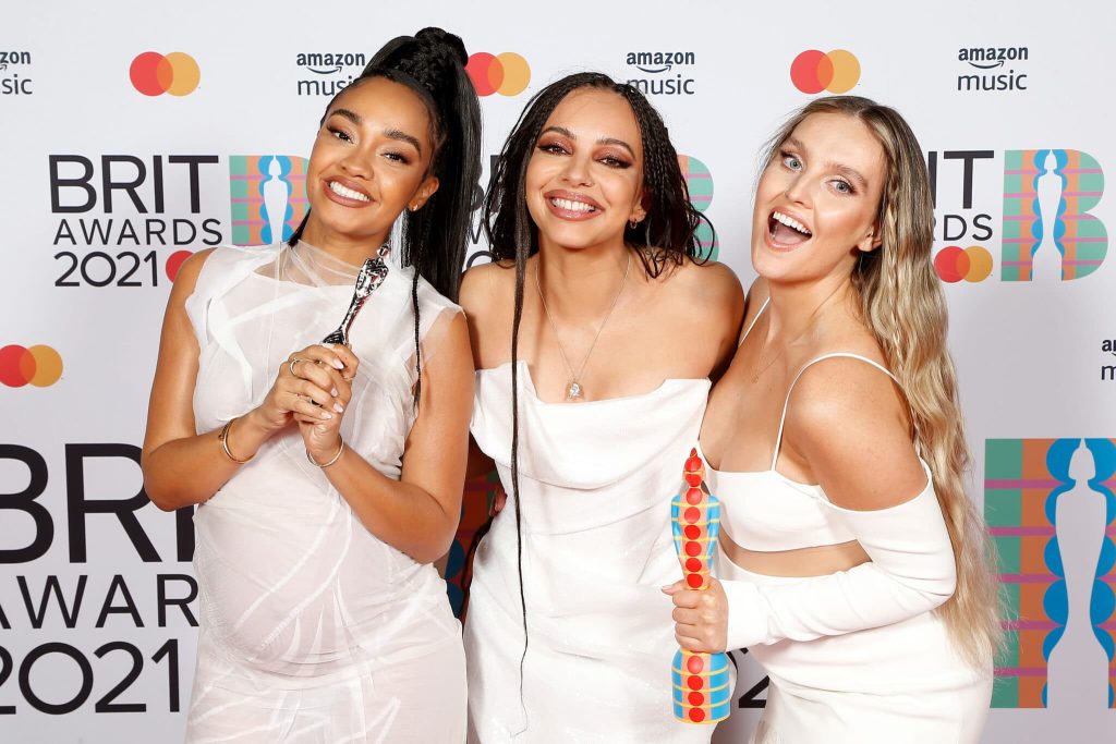 Leigh-Anne Pinnock, Jade Thirlwall and Perrie Edwards pose with their British Group award in the media room during The BRIT Awards 2021