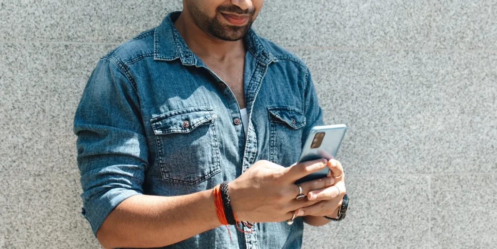 indian man using phone