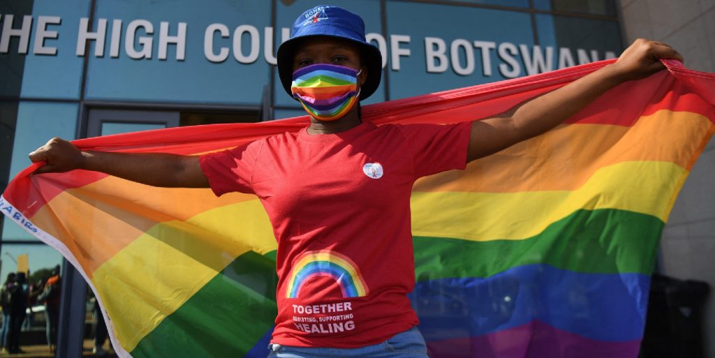 Activists carry a rainbow flag outside the Botswana High Court on October 12, 2021